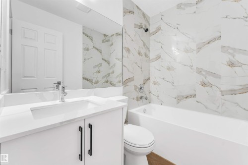 Full bath with vanity and shower / bathtub combination - 107 9760 176 St, Edmonton, AB - Indoor Photo Showing Bathroom