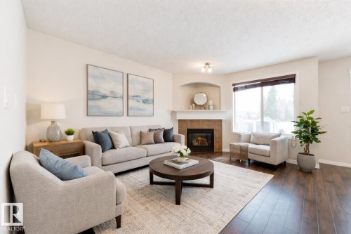 114 Hartwick Loop, Spruce Grove, AB - Indoor Photo Showing Living Room With Fireplace