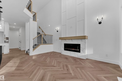 3608 40 Avenue, Beaumont, AB - Indoor Photo Showing Living Room With Fireplace