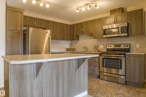 211 1820 Rutherford Road, Edmonton, AB - Indoor Photo Showing Kitchen With Stainless Steel Kitchen