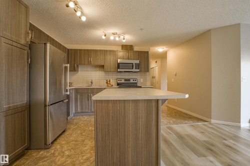 211 1820 Rutherford Road, Edmonton, AB - Indoor Photo Showing Kitchen With Stainless Steel Kitchen
