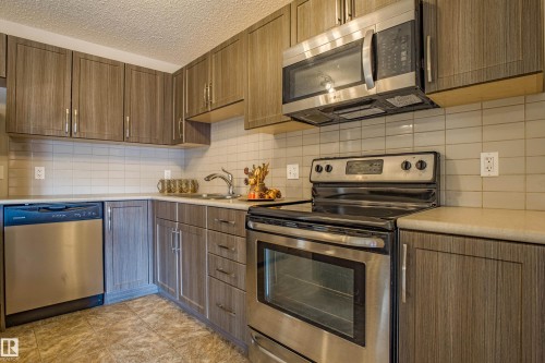 211 1820 Rutherford Road, Edmonton, AB - Indoor Photo Showing Kitchen With Stainless Steel Kitchen