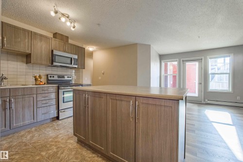 211 1820 Rutherford Road, Edmonton, AB - Indoor Photo Showing Kitchen With Stainless Steel Kitchen