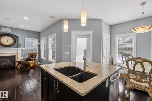 1519 Chapman Way, Edmonton, AB - Indoor Photo Showing Other Room With Fireplace