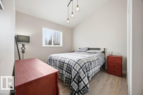 62 Pointe, Beaumont, AB - Indoor Photo Showing Bedroom