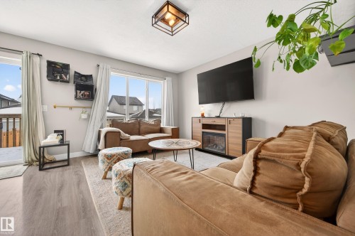 48 Sierra Wynd, Fort Saskatchewan, AB - Indoor Photo Showing Living Room With Fireplace