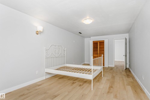Unfurnished bedroom with a closet and light wood-style floors - 13520 113A Street, Edmonton, AB - Indoor Photo Showing Other Room