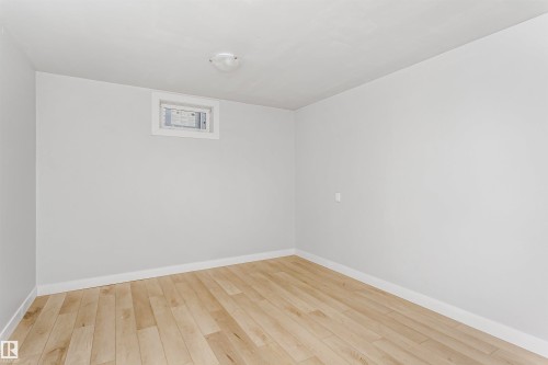 Spare room featuring light wood-style floors and baseboards - 13520 113A Street, Edmonton, AB - Indoor Photo Showing Other Room