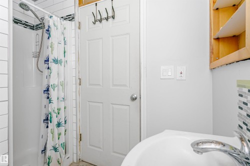 Bathroom featuring a stall shower and a sink - 13520 113A Street, Edmonton, AB - Indoor Photo Showing Bathroom