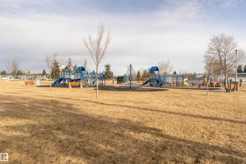 Community playground with a lawn - 13520 113A Street, Edmonton, AB - Outdoor With View