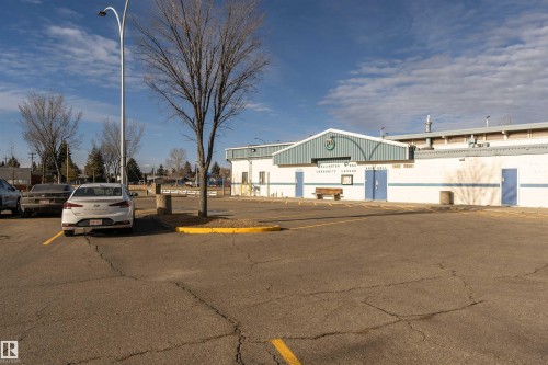 View of building exterior featuring uncovered parking - 13520 113A Street, Edmonton, AB - Outdoor
