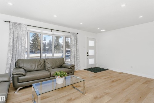 Living area with light wood-type flooring and recessed lighting - 13520 113A Street, Edmonton, AB - Indoor Photo Showing Living Room