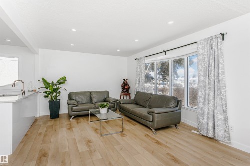 Living room featuring light wood-style flooring and recessed lighting - 13520 113A Street, Edmonton, AB - Indoor Photo Showing Living Room