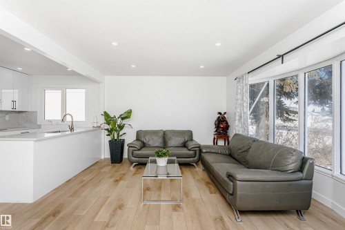 Living room featuring light wood finished floors and recessed lighting - 13520 113A Street, Edmonton, AB - Indoor Photo Showing Living Room