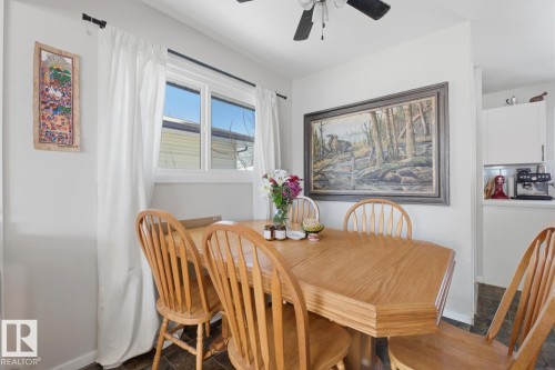 Dining space with ceiling fan and baseboards - 11332 134 Avenue, Edmonton, AB - Indoor Photo Showing Dining Room