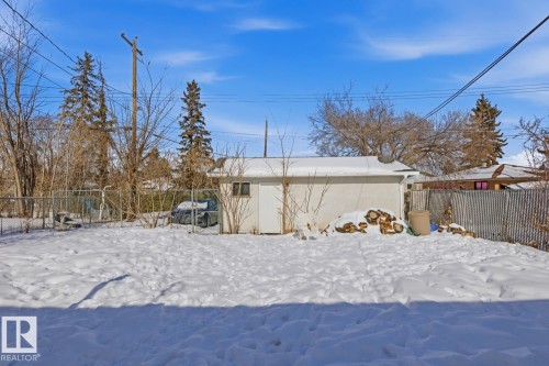 The property features a fenced yard with a detached structure - 11332 134 Avenue, Edmonton, AB - Outdoor