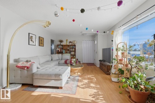 Living area featuring light wood-style floors - 11332 134 Avenue, Edmonton, AB - Indoor Photo Showing Living Room
