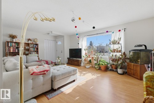 Living room featuring light wood-type flooring - 11332 134 Avenue, Edmonton, AB - Indoor Photo Showing Living Room
