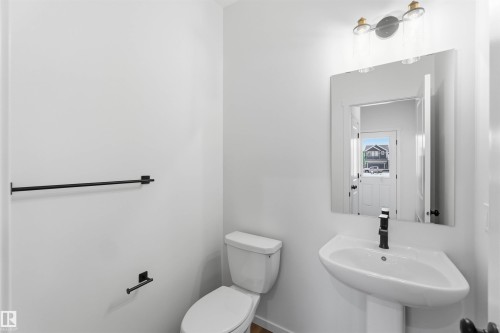Bathroom with toilet and a sink - 8652 Edgemont Link Link, Edmonton, AB - Indoor Photo Showing Bathroom