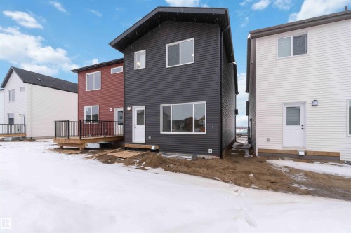 Snow covered property featuring a deck - 8652 Edgemont Link Link, Edmonton, AB - Outdoor With Exterior