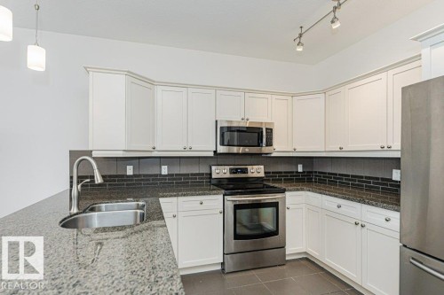 302 160 Magrath Road, Edmonton, AB - Indoor Photo Showing Kitchen With Double Sink