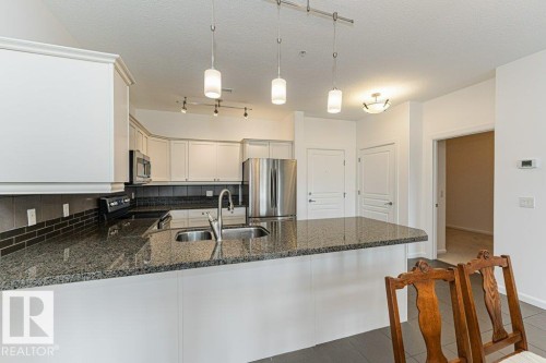 302 160 Magrath Road, Edmonton, AB - Indoor Photo Showing Kitchen With Double Sink With Upgraded Kitchen