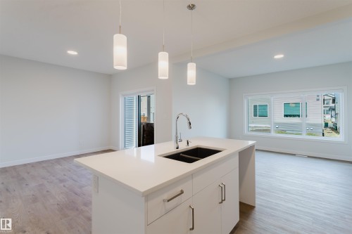 358 Bluff Cove, Leduc, AB - Indoor Photo Showing Kitchen With Double Sink