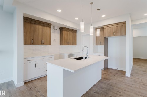 358 Bluff Cove, Leduc, AB - Indoor Photo Showing Kitchen With Double Sink
