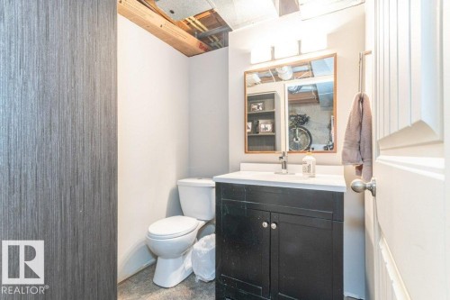 Half bath with toilet and vanity - 88 Hearthstone Nw, Edmonton, AB - Indoor Photo Showing Bathroom