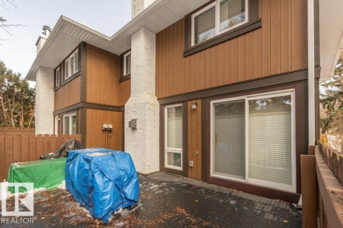 Showing patio doors from living room opening onto the deck - 88 Hearthstone Nw, Edmonton, AB - Outdoor With Exterior