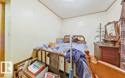Bedroom with ornamental molding - 59415A Rg Rd 240, Rural Westlock County, AB - Indoor