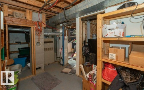 Unfinished basement featuring water heater and washer / dryer - 59415A Rg Rd 240, Rural Westlock County, AB - Indoor Photo Showing Basement