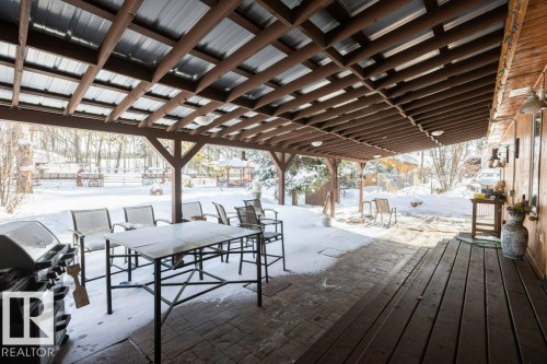 Snow covered deck with area for grilling, a patio area, and outdoor dining area - 59415A Rg Rd 240, Rural Westlock County, AB - Outdoor With Deck Patio Veranda