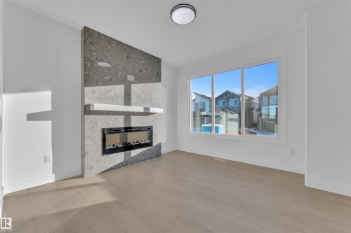 283 Munn Way, Leduc, AB - Indoor Photo Showing Living Room With Fireplace