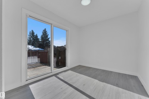 Empty room featuring baseboards and light wood-type flooring - 8635 33 Avenue, Edmonton, AB - Indoor Photo Showing Other Room