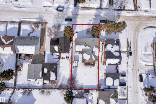 Snowy aerial view with property parcel outlined and a residential view - 8635 33 Avenue, Edmonton, AB - Outdoor With View