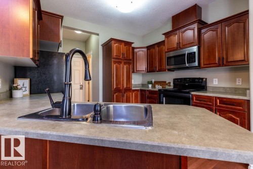 11546 11 Avenue, Edmonton, AB - Indoor Photo Showing Kitchen With Double Sink