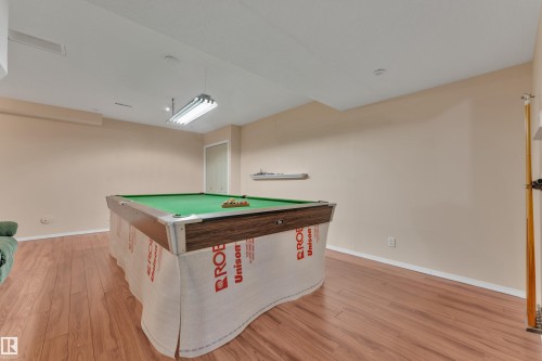 Game room with billiards table and light wood-style floors - 6017 213 Street, Edmonton, AB - Indoor Photo Showing Other Room