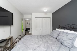 Bedroom featuring a closet and a textured ceiling - 