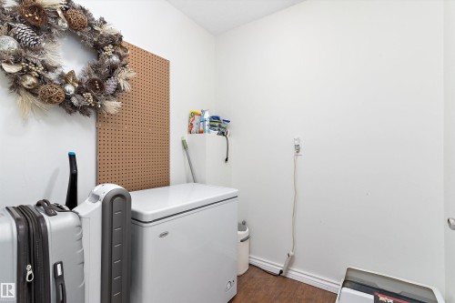 Sttorage room featuring dark wood-type flooring and baseboards - # 3 13450 Fort Road, Edmonton, AB - Indoor