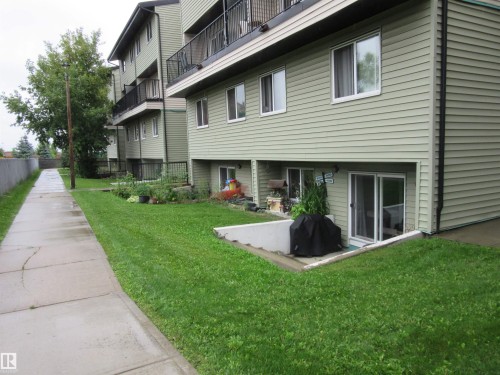 View of property's community featuring a lawn - # 3 13450 Fort Road, Edmonton, AB - Outdoor