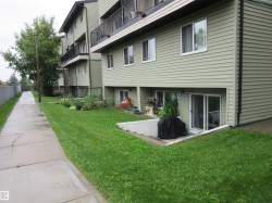 View of property's community featuring a lawn - 