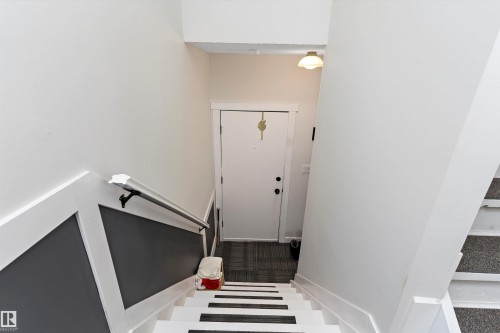 Stairs with baseboards - # 3 13450 Fort Road, Edmonton, AB - Indoor Photo Showing Other Room