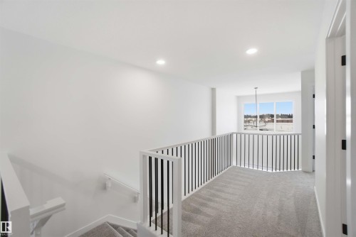 Corridor with carpet, recessed lighting, and an upstairs landing - 19348 29 Avenue, Edmonton, AB - Indoor Photo Showing Other Room