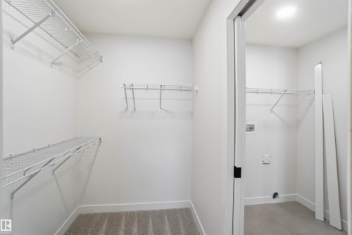 View of walk in closet - 19348 29 Avenue, Edmonton, AB - Indoor With Storage