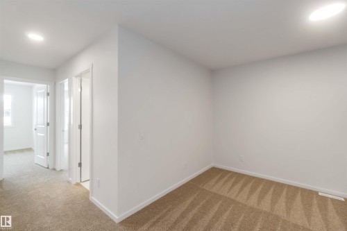 Additional living space featuring light carpet and recessed lighting - 18912 28 Avenue, Edmonton, AB - Indoor Photo Showing Other Room