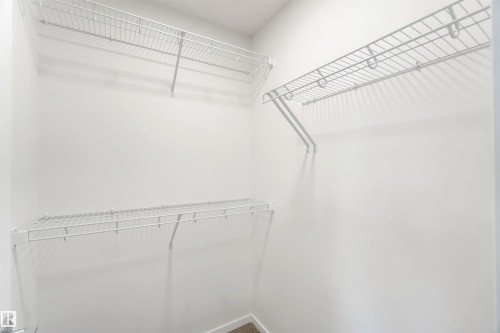 View of walk in closet - 18912 28 Avenue, Edmonton, AB - Indoor With Storage