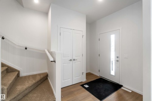 Entryway featuring stairway and light wood-style flooring - 18912 28 Avenue, Edmonton, AB - Indoor Photo Showing Other Room