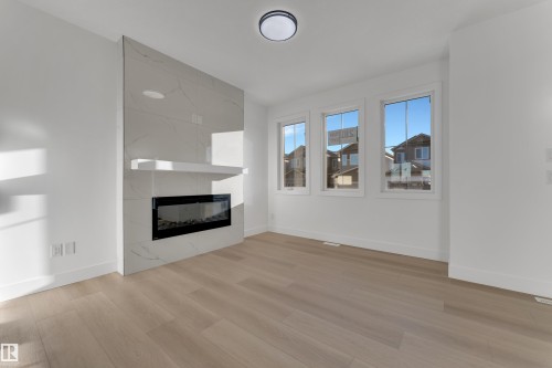 281 Munn Way, Leduc, AB - Indoor Photo Showing Living Room With Fireplace