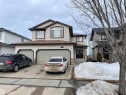 View of front facade featuring concrete driveway, a garage, and a shingled roof - 6116 53 Avenue, Beaumont, AB  - Outdoor With Facade 